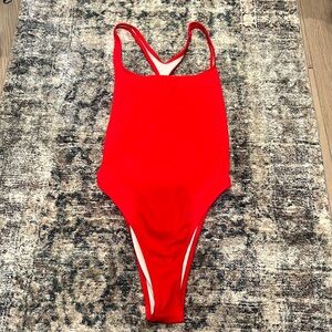 Solid and Striped high thigh suit